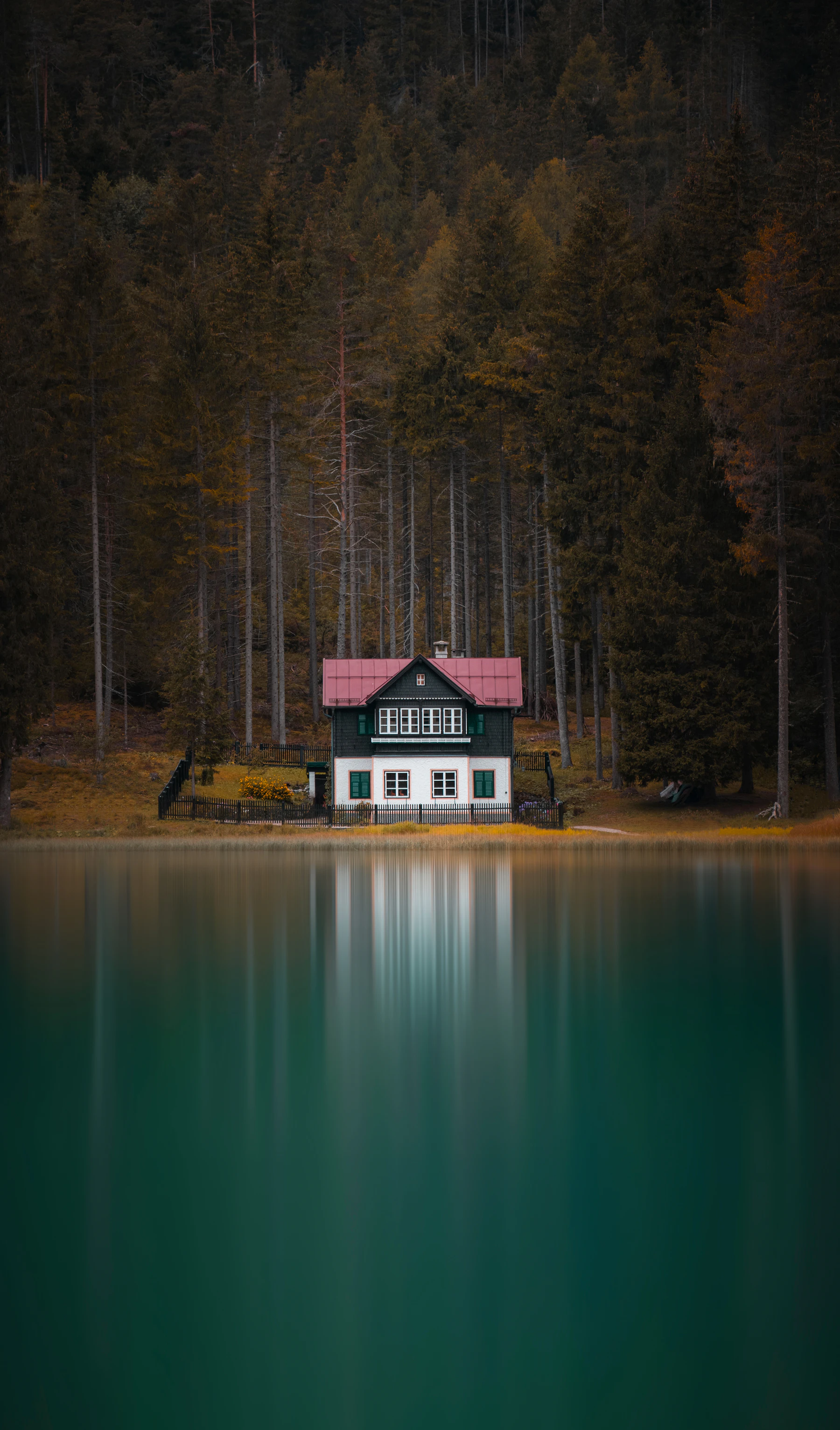 The same lake house in autumn colors