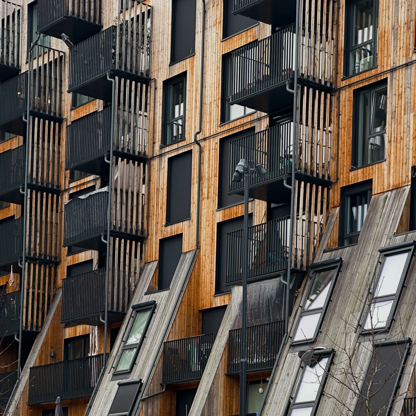 Timber facade with balconies and windows