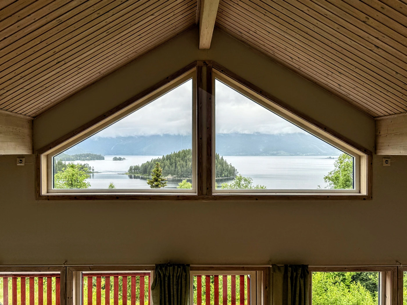 View of a lake and wooded islands through a window
