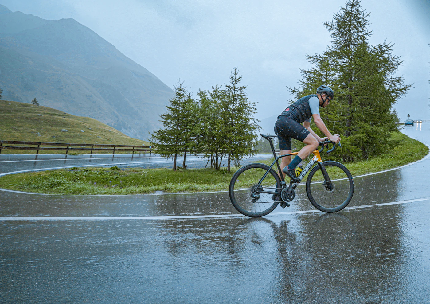 Cyclist on a wet mountain road