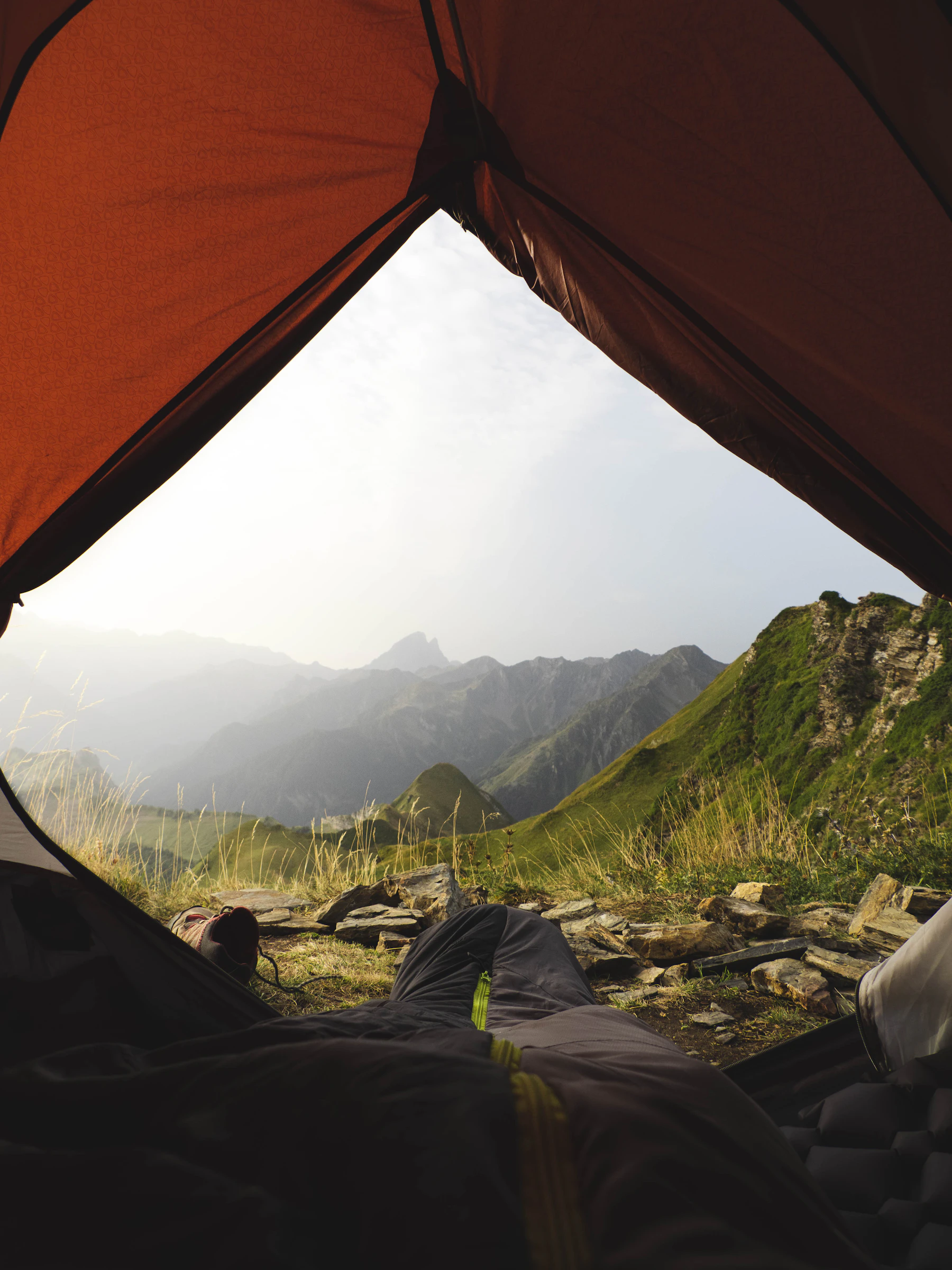 View of a mountain range from inside a tent